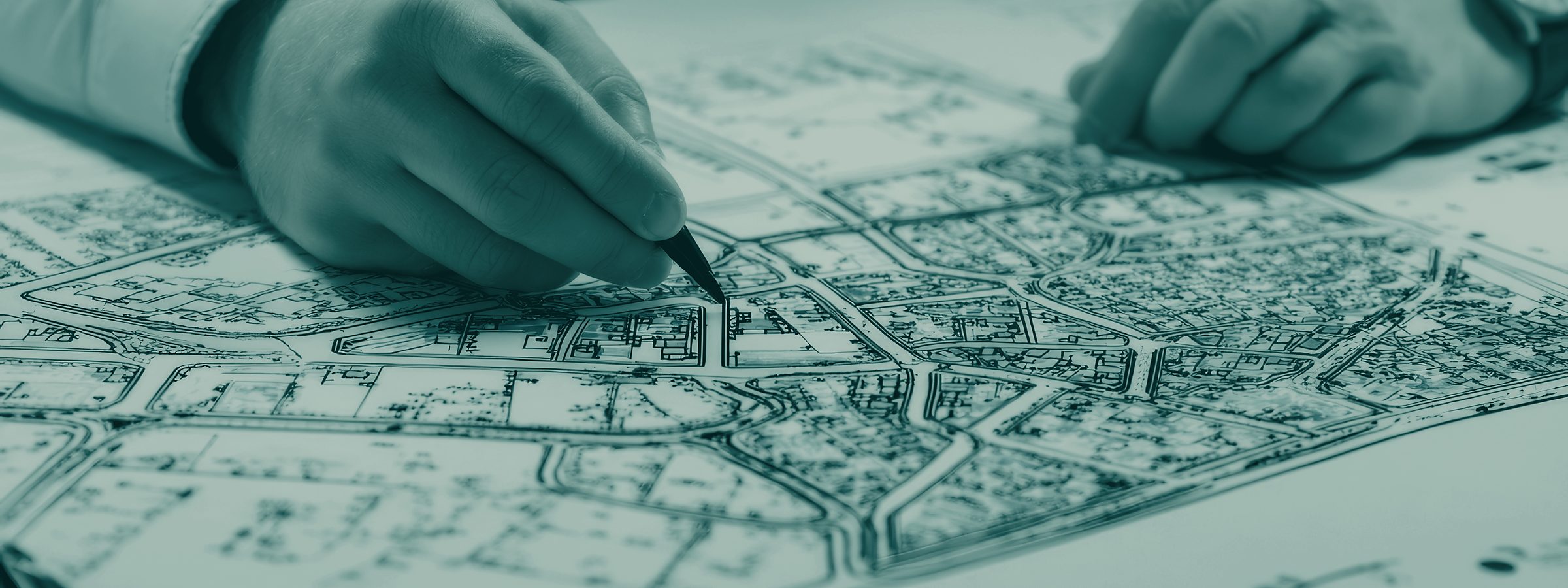 A masterplan drawing on a desk, annotated by hand