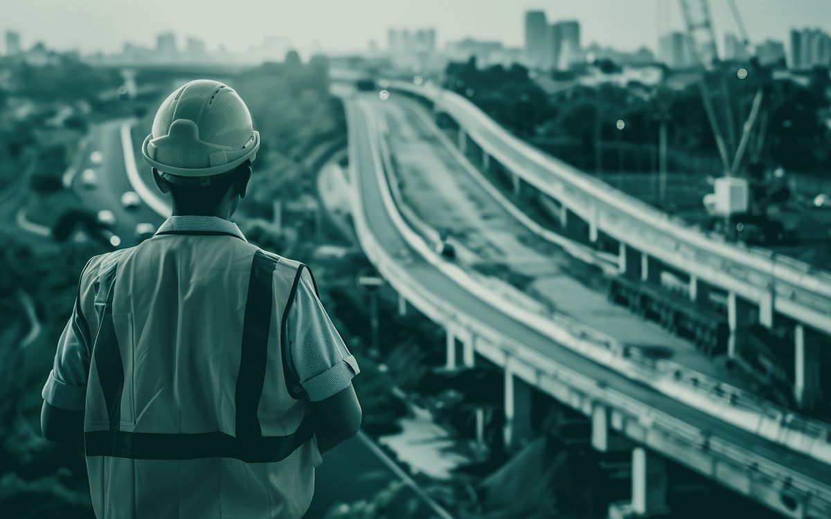 An engineer looking out over new transport infrastructure under construction